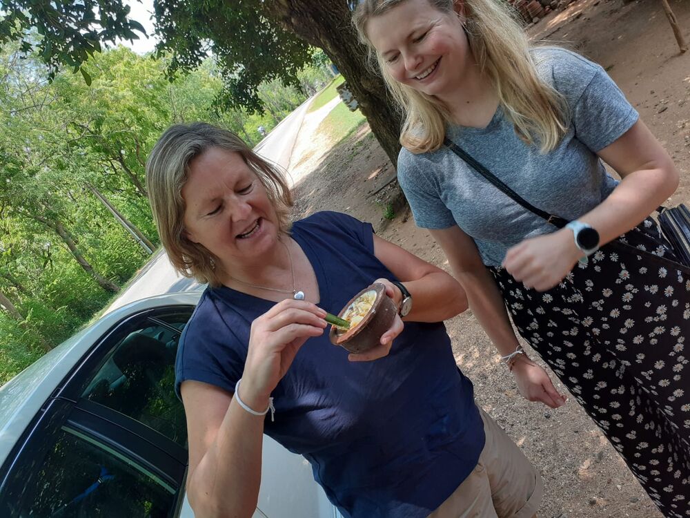 Guests trying a local roadside snack