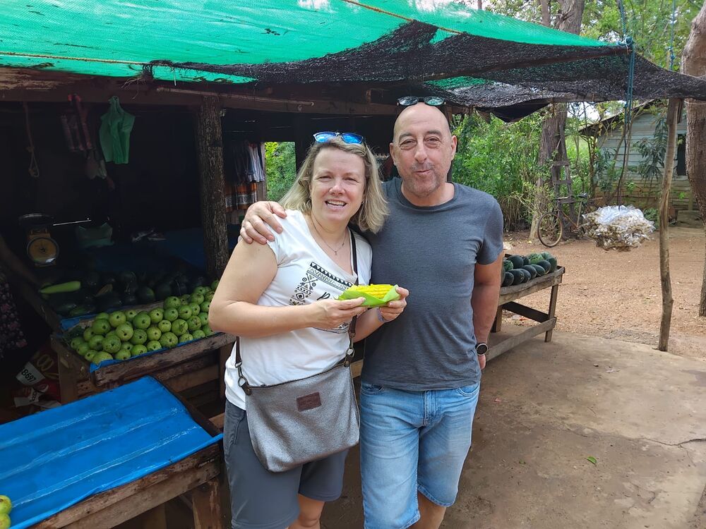 Guests at a roadside fruit and corn stall